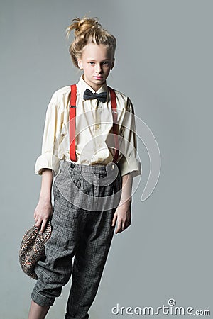 Expressing myself with fashion. jazz step fashion. teen girl in retro male suit. vintage english style. suspender and Stock Photo