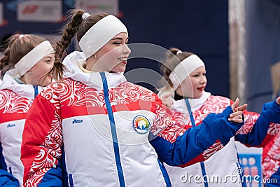 Expression performance of pretty girls of dance group in clothes with symbols of Russia Editorial Stock Photo