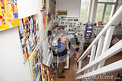 Expressionist artist in his art studio Stock Photo