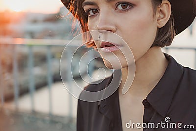 Expressive attentive look girl teenager in black hat. Stock Photo