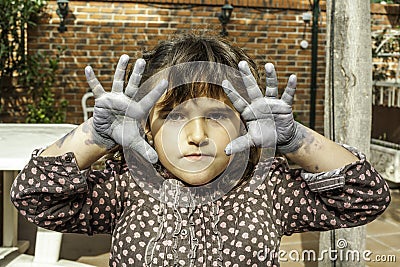 Expressive girl portrait acting with painted hands Stock Photo