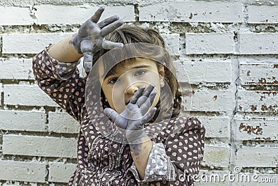 Expressive girl portrait acting with painted hands Stock Photo