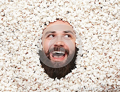 Expressive man posing in popcorn Stock Photo