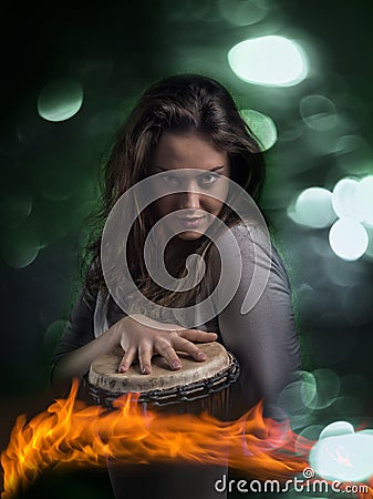 Expressive Wild Woman Playing Djembe Drum Stock Photo