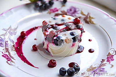 Exquisite dessert - a cool jelly with fresh berries on a light plate Stock Photo