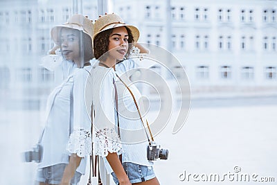 African-American tourist girl with vintage camera outdoor Stock Photo