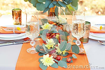 Exquisitely decorated table for two. Autumn themed table setting Stock Photo