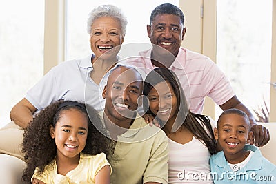 Extended family sitting on sofa Stock Photo