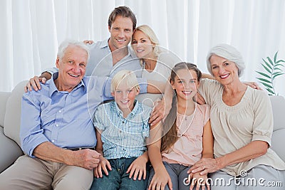 Extended family smiling at camera Stock Photo