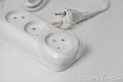 Extension cord for three sockets with a long coiled cord Stock Photo