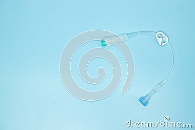 Extension tube with connector for intravenous catheter on blue b Stock Photo