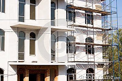 Extensive scaffolding for building a new house. Constraction of platforms for building works Stock Photo