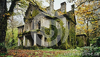 Exterior of Abandoned luxury mansion completely covered with moss Stock Photo