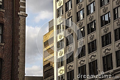 Exterior art deco pre-modern office building facade in city with decorative cartouche Stock Photo