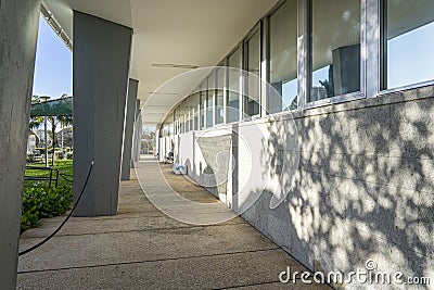 exterior corridor with plastic benches in the headquarters building of RTP, Portuguese radio and television in Lisbon. Editorial Stock Photo