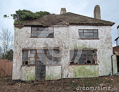 Exterior of derelict house built in 1930s deco style, Rayners Lane, Harrow UK Editorial Stock Photo