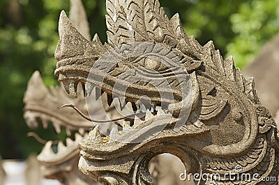 Exterior detail of the Naga (giant snake), protecting the Haw Phra Kaew temple in Vientiane, Laos. Stock Photo