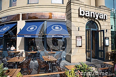 Exterior entrance to Banyan restaurant cafe with seating area Editorial Stock Photo