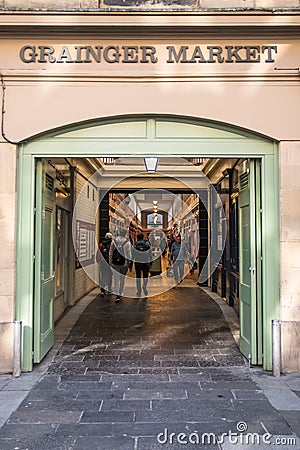 Exterior entrance to Grainger Market traditional indoor shopping in Newcastle with people entering and leaving Editorial Stock Photo