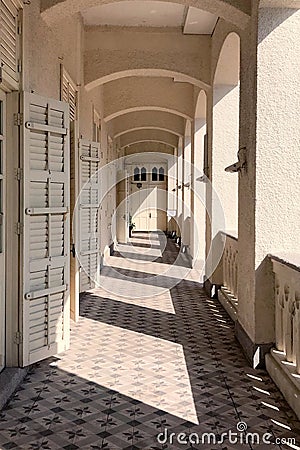 Exterior hallway of Christian church with sunlight, shadow Stock Photo