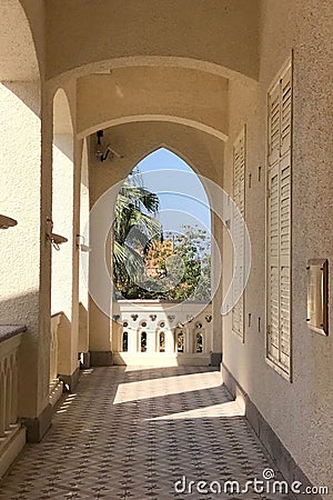 Exterior hallway of Christian church with sunlight, shadow Stock Photo