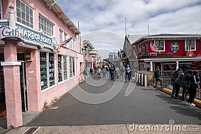 Exterior of harbor house gift shop in city with cloudy sky in background Editorial Stock Photo