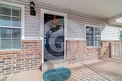 Exterior of house on a sunny neighborhood with christmas wreath on front door Stock Photo