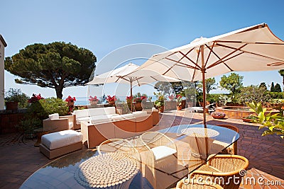 Villa terrace overlooking sea, summer day Stock Photo