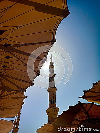Exterior of Nabawi Mosque building and electronic umbrella in Medina Stock Photo