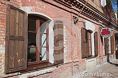 Exterior of the old brick building in Uzupio area in Vilnius, Lithuania. Editorial Stock Photo