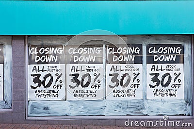 Exterior Of Shop With Closing Down Notice In Window Stock Photo