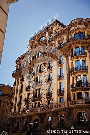 Exterior shot of an architectural building with multiple windows: Barcelona Editorial Stock Photo