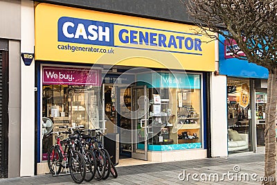 Exterior shot of Cash Generator Pawn Shop with electronics, jewelry and bikes on display Editorial Stock Photo