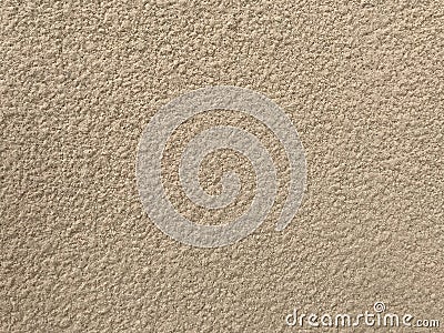 An Exterior textured painted outside of the highrise building with beige color and looking like grey and making a rough undulating Stock Photo