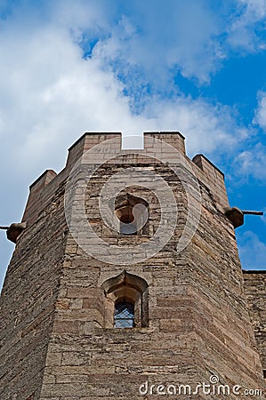 Exterior view of an antique medieval English castle tower facade from below Stock Photo