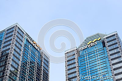 Exterior view of the building and logo of the state-owned enterprise Mandiri Bank Editorial Stock Photo