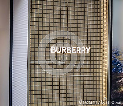 Exterior view of a Burberry store and company logo in the huge luxurious mall Editorial Stock Photo