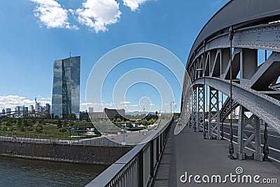 Exterior view of a cemthe honsell bridge with new building of the european central bank ezb in Frankent factory with green crane Editorial Stock Photo