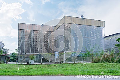 Exterior view of a commercial vertical farm in Singapore. To maximise land for food production, vegetables are grown in A-shaped Stock Photo