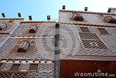 Exterior view of old houses in Rosetta made of colored bricks and wooden arabesque windows Stock Photo