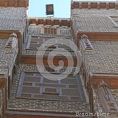 Exterior view of old houses in Rosetta made of colored bricks and wooden arabesque windows Stock Photo