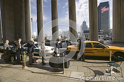 Exterior view of yellow taxi cab in front of the 30th Street Station, a national Register of Historic Places, AMTRAK Train Statio Editorial Stock Photo