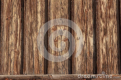 Exterior wall background with board and batten wood, heavily weathered, peeling and cracked paint Stock Photo