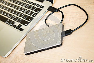 External hard drive connected to laptop computer Stock Photo