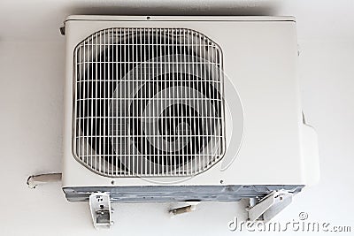 External part of split system air conditioning unit mounted on wall, close up view Stock Photo