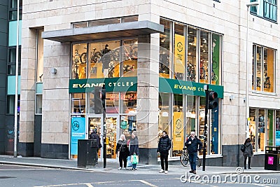 External shot of Evan Cycles Bicycle store with people outside Editorial Stock Photo