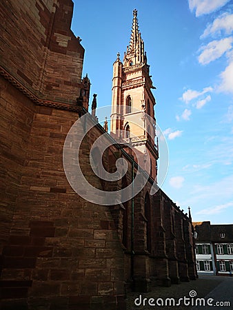 External side of the cathedral of Basel in Switzerland during a warm spring morning Stock Photo