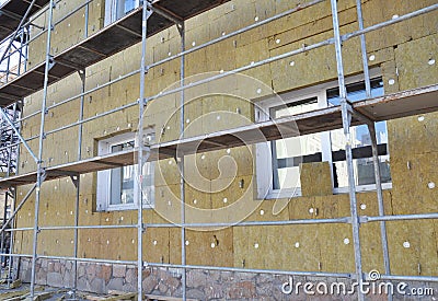 External wall insulation. Solid wall insulation. Energy efficiency house wall renovation for energy saving. Stock Photo