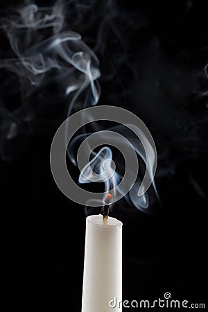 Extinguished candle with smoke Stock Photo