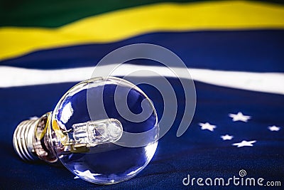 Extinguished light bulb over the Brazilian flag, concept of Brazilian energy crisis, blackout risk Stock Photo